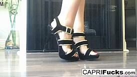 capri the brunette pornstar masturbates her pussy solo in high heels