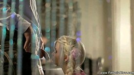 A blonde milf strips naked and gives a clothed guy a blowjob.