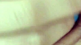 Tanned latina flaunting her natural tits and juicy pussy in a lively display.