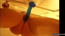 Alexis 19 fucks blue dildo mounted on door and squirts all over her pussy.