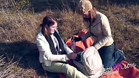 Lesbian friends enjoy outdoor strap-on fucking with brunette girlfriend