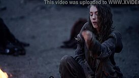 In this fantasy, baremaidens gather around the campfire