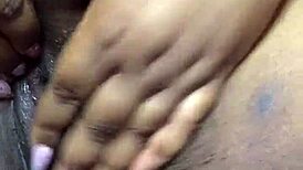 ebony babe fingers herself to intense squirting