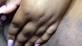 ebony babe fingers herself to intense squirting