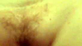 A redhead woman showcases her ginger-colored breasts in a natural setting.