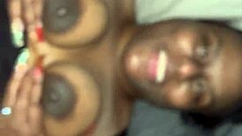 pretty ebony woman displays her tits and pussy for the camera