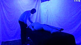Gigi breeze receives detailed blacklight massage with fetish elements from black masseur