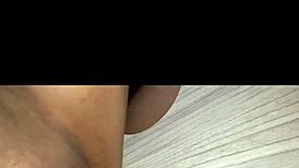 Eagerly sucking massive cock through the gloryhole setup