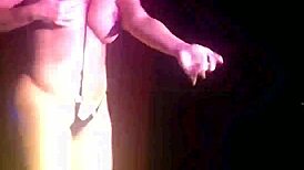 Stripper girl performs hot striptease with clothes ripped.