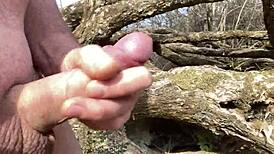 Cumming Hard by the River with a Curved Upwards Cock