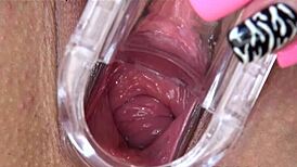 Petite brunette explores toys in close-up