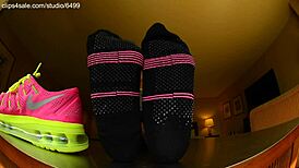 Tall girl shows sexy barefoot feet in Nike shoes for foot fetish domination