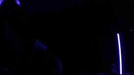 Carrie B indulging in blacklight sex with small tits.