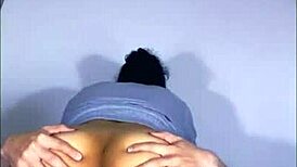 art student shows work to male friend in apartment