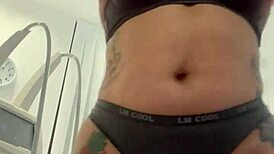 Blonde Tattoo Tease Removing Clothes