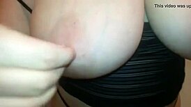 Sheila, the busty milf wife, rips her clothes off in a seductive striptease, revealing her big tits while undressing slowly.