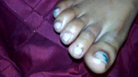 Ebony foot job with cumshot on feet