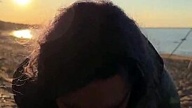 Feeling the passion as she gives a blowjob on the beach