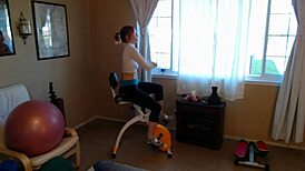 Russian beauty prefers cardio burn on stationary bike