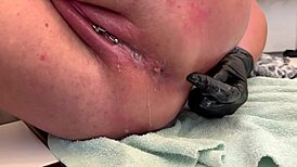 european housewife fingers her asshole with three gloves, gaping it wide, and pees at the end