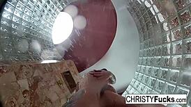 Steamy shower turned wild with Christy, Dahlia, and Ivan enjoying hot lesbian play. Their tattooed bodies glistened under water.