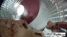 Steamy shower turned wild with Christy, Dahlia, and Ivan enjoying hot lesbian play. Their tattooed bodies glistened under water.