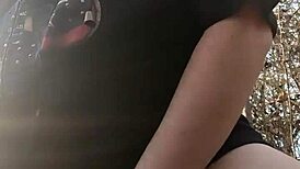 Woman gets fucked with dildo in the forest, moaning loudly.