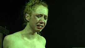 Sexy thrall naked in BDSM scene sucks cock to orgasm.