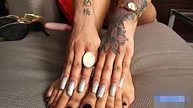 ebony shemale shows off her sexy feet while masturbating