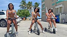Big ass Latinas RIDING electric trikes at a public beach. Man, that BIG BOOTY shakes wild!