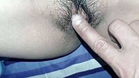 My young girlfriend lets me play with her wet pussy while watching tv