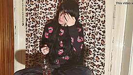 smoking goth girl relaxes behind the scene after a long day?