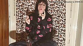 smoking goth girl relaxes behind the scene after a long day?