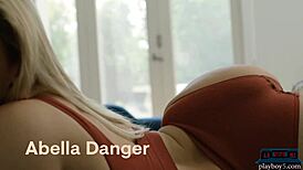 Blonde pornstar Abella Danger strips clothes and poses with her big round ass.