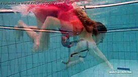 Feeling the thrill of firm tits in red dress underwater