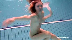 Feeling the thrill of firm tits in red dress underwater