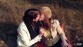 Lesbian couple shares a kiss outdoors, then heats up with a strapon.