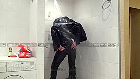 Master In Blue Jeans Washes Feet In Bathroom