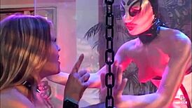 A masked girl in a cage watches a foursome during her slave training – what a wild group.