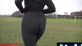Mature milf strolls in park with huge ass in leggings