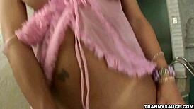 Tasty brunette tranny babe tugging cock poolside!
