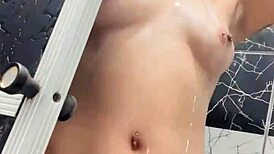 Tattooed Woman Showers And Displays Her Tits And Pussy