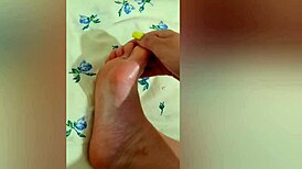 young babe strokes her sexy feet with pink pedicure, reaching luxury orgasm