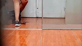 Hidden cam catches the secretary in her office routine