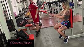 Blonde Amateur Gets Her Dick Touched by Tattooed Instructor in Gym Session