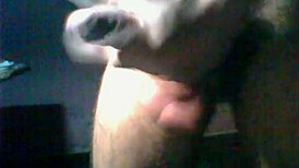 A detailed scene of hairy dick masturbation featuring a man stroking his thick, hairy cock in close-up view