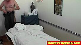 Asian handjob masseuse tugging hard cock in hidden cam