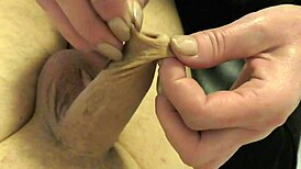 foreskin teased first, then latex gloves take over next