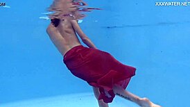 Petite brunette swims in the pool and enjoys sensual pleasures.