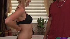 Blond masseuse grinds in bathroom before handjob.